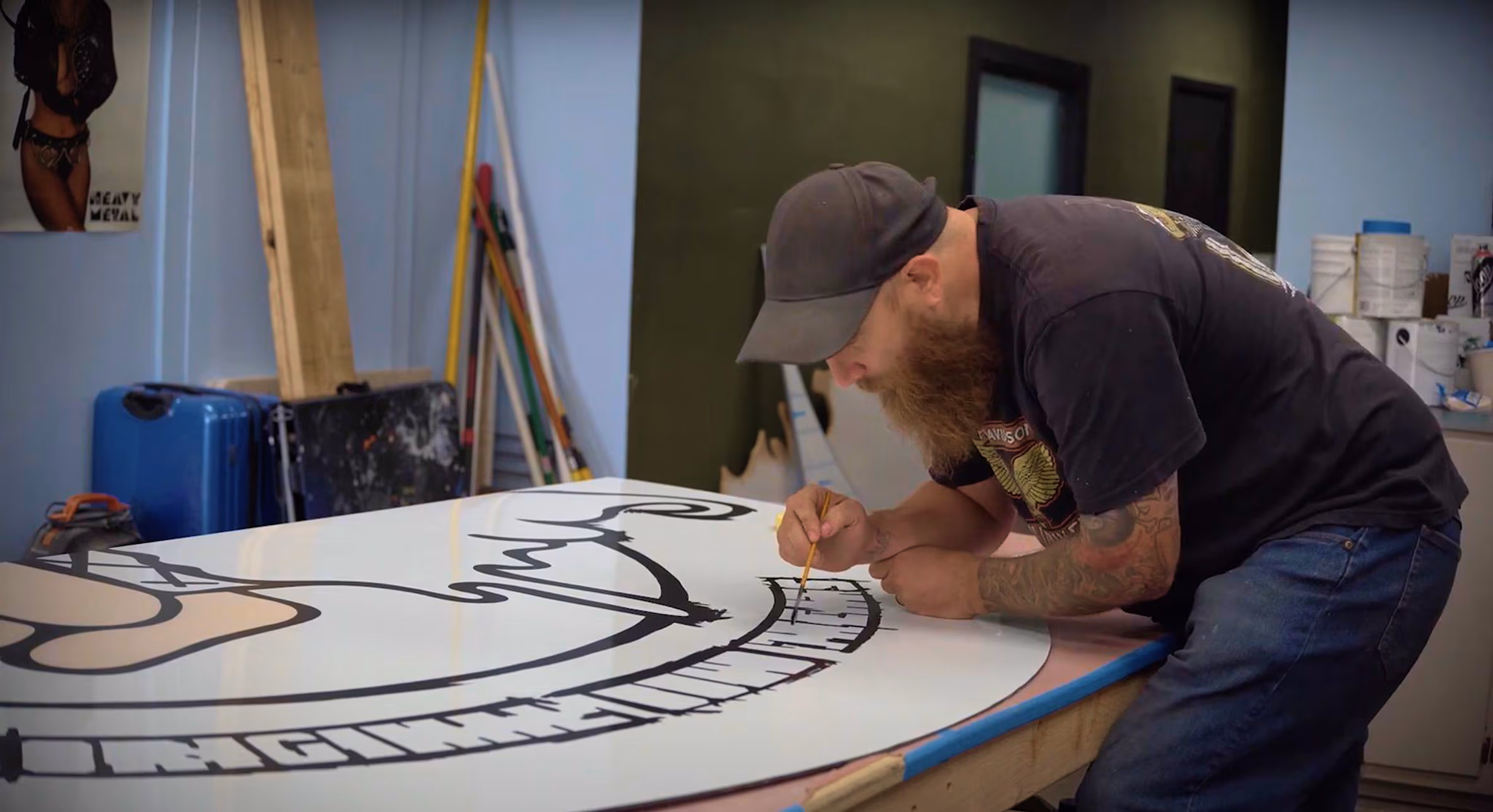 Dale hand-painting a project in the workshop